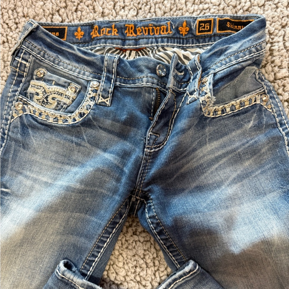 Rock Revival Distressed Blue Jeans with Rhinestone Accents